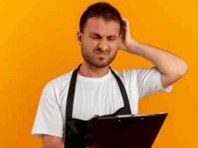 Restaurant staff member looking confused while reviewing operational checklist or inventory